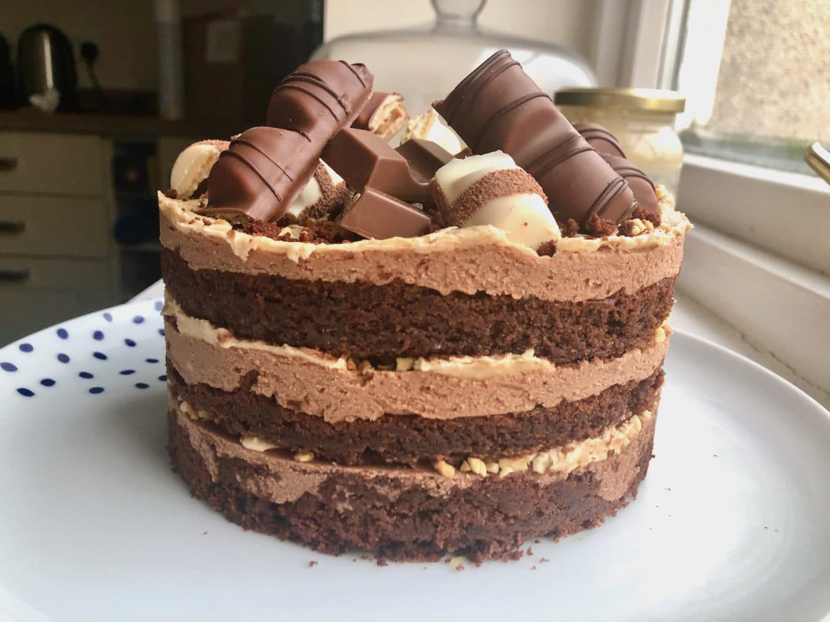 Premium Photo | A chocolate cake with a chocolate bar on top